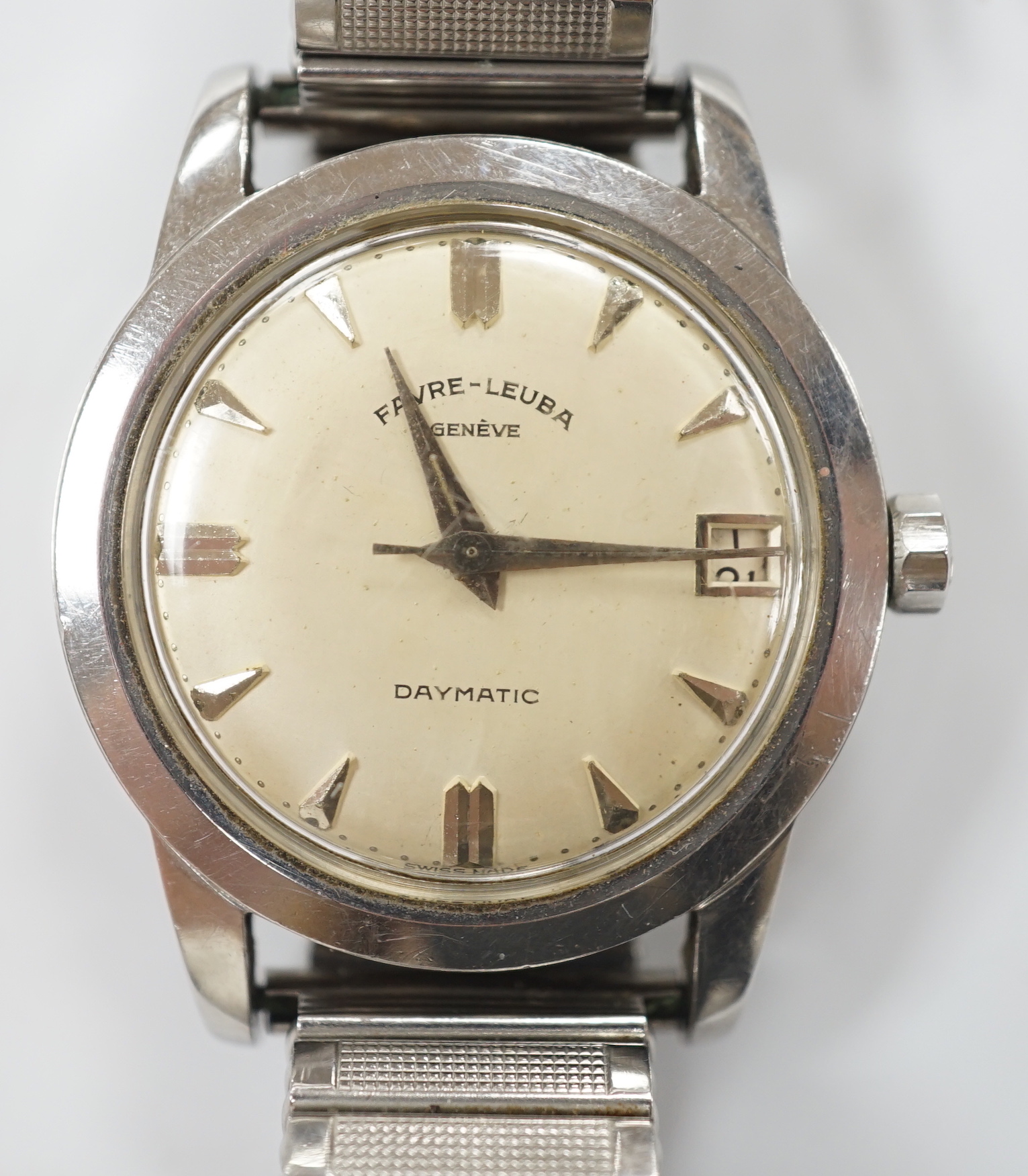 A gentleman's stainless steel Favre Leuba Daymatic manual wind wrist watch, on associated flexible strap.